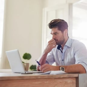 man reading about insurance